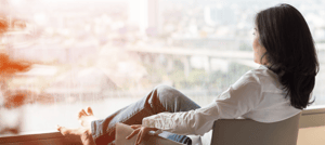 Woman looking out the window