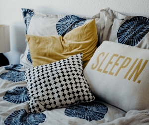 Assorted natural and synthetic bed pillows