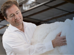 Tony Keleman, owner of Royal Pedic, alongside a product