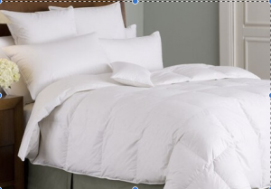Down comforter on bed with pillows
