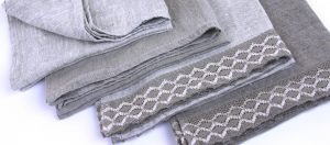 Four linen kitchen towels with decorative lace
